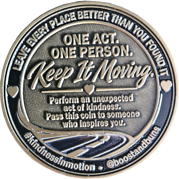 Back of the Kindness in Motion coin, engraved: One act. One person. Keep it moving. Perform an unexpected act of kindness. Pass this coin to someone who inspires you.